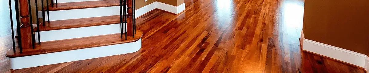 Base floor of a staircase with professionally restored wood flooring in New Orleans LA