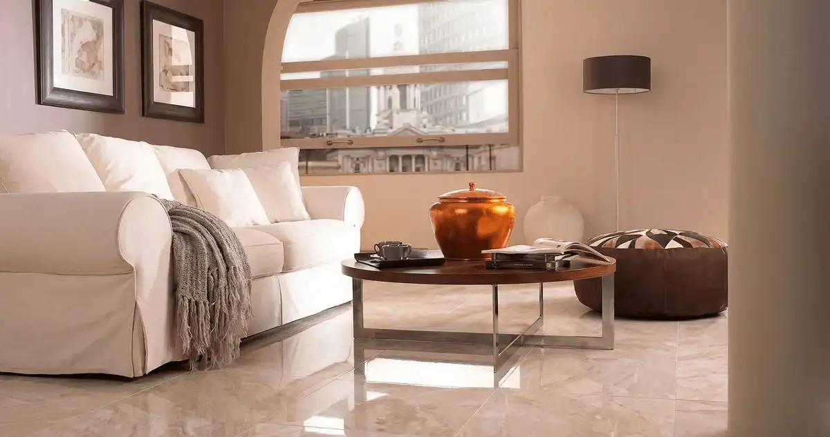 Modern living room with professionally installed marble flooring, a beige sofa, coffee table in New Orleans, LA