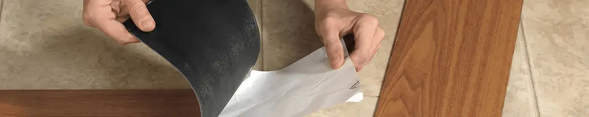A professional installing vinyl flooring in New Orleans, LA