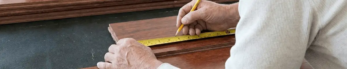 A professional installing wood flooring in New Orleans, LA